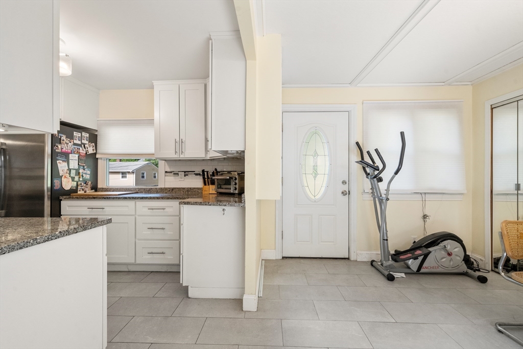 17 Chandler Road Malden, MA 02148 - Photo 13 of 19 a kitchen with a sink a refrigerator and cabinets