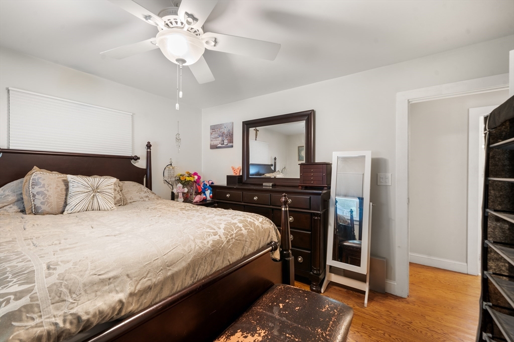 17 Chandler Road Malden, MA 02148 - Photo 15 of 19 a bedroom with a bed and a chandelier