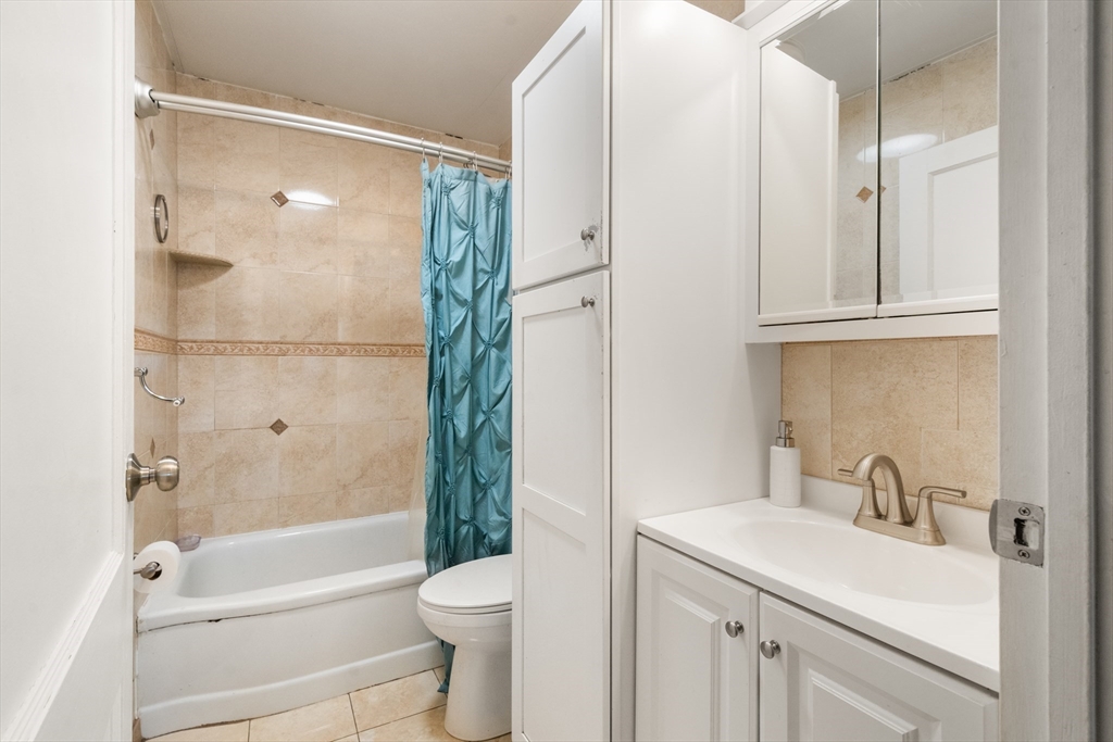 17 Chandler Road Malden, MA 02148 - Photo 18 of 19 a bathroom with a sink toilet and shower