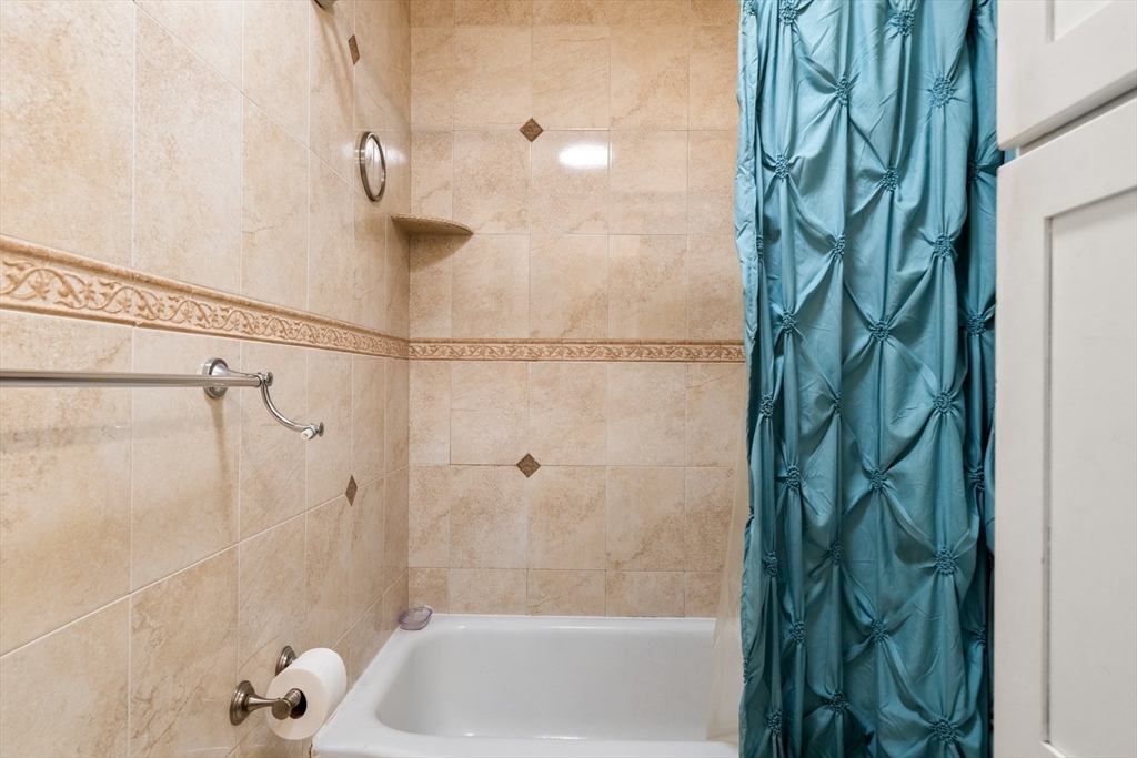 17 Chandler Road Malden, MA 02148 - Photo 19 of 19 a bathroom with a shower and a tub