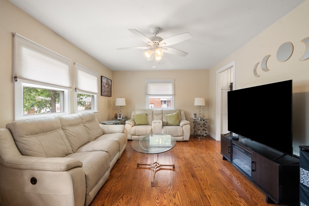 17 Chandler Road Malden, MA 02148 - Photo 5 of 19 a living room with furniture and a flat screen tv