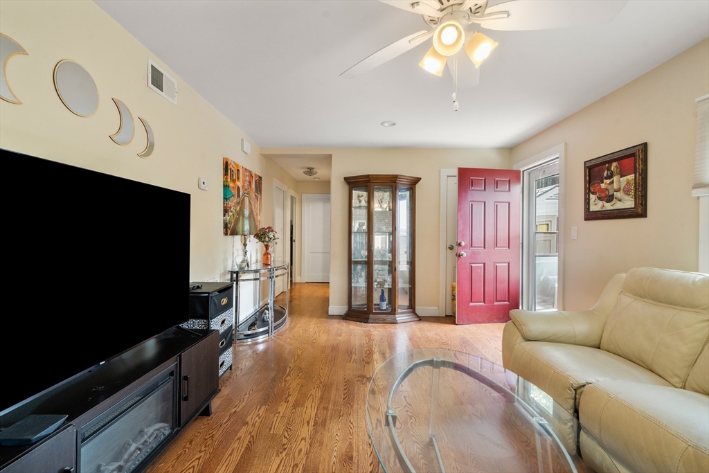 17 Chandler Road Malden, MA 02148 - Photo 6 of 19 a living room with furniture and a flat screen tv