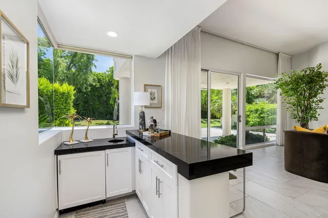 a kitchen with a counter top space and a sink