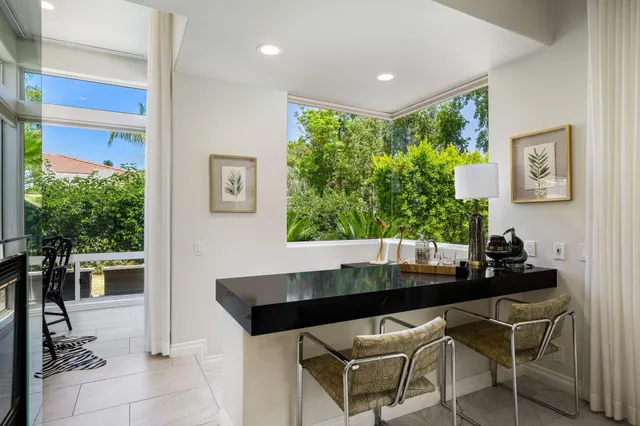 a room with dining table and chairs