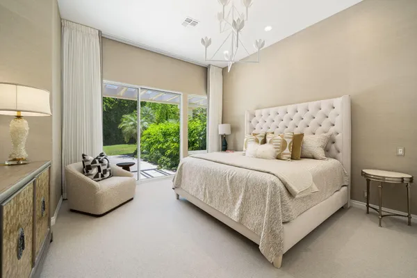 a bedroom with a bed and a couch