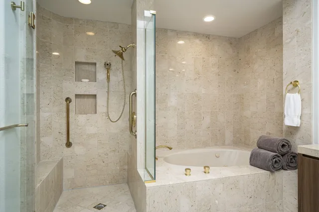 a bathroom with a shower and a tub
