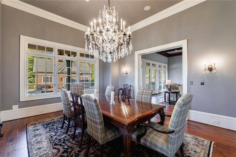 15750 Freemanville Road Milton, GA 30004 - Photo 13 of 30 a view of a dining room with furniture and chandelier