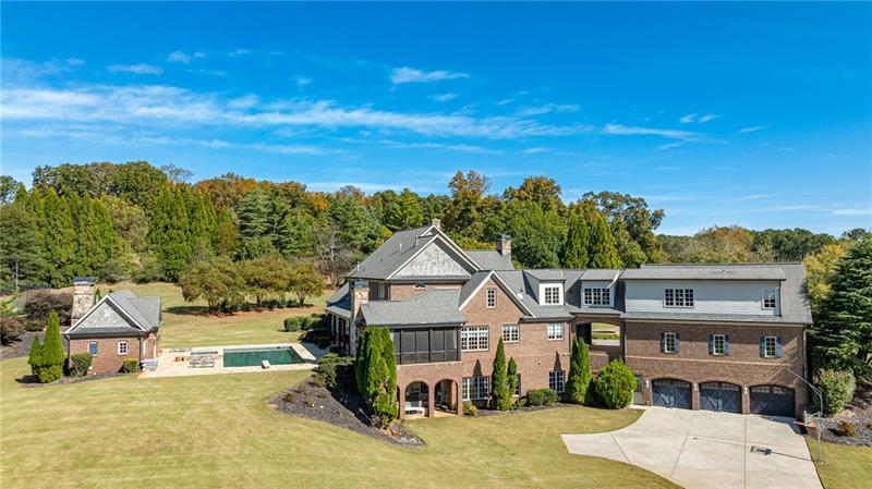 15750 Freemanville Road Milton, GA 30004 - Photo 9 of 30 a front view of a house with a yard and mountain view