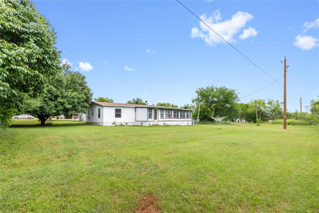 210 7th Street Blanket, TX 76432 - Photo 25 of 33 a view of a big yard with a large tree