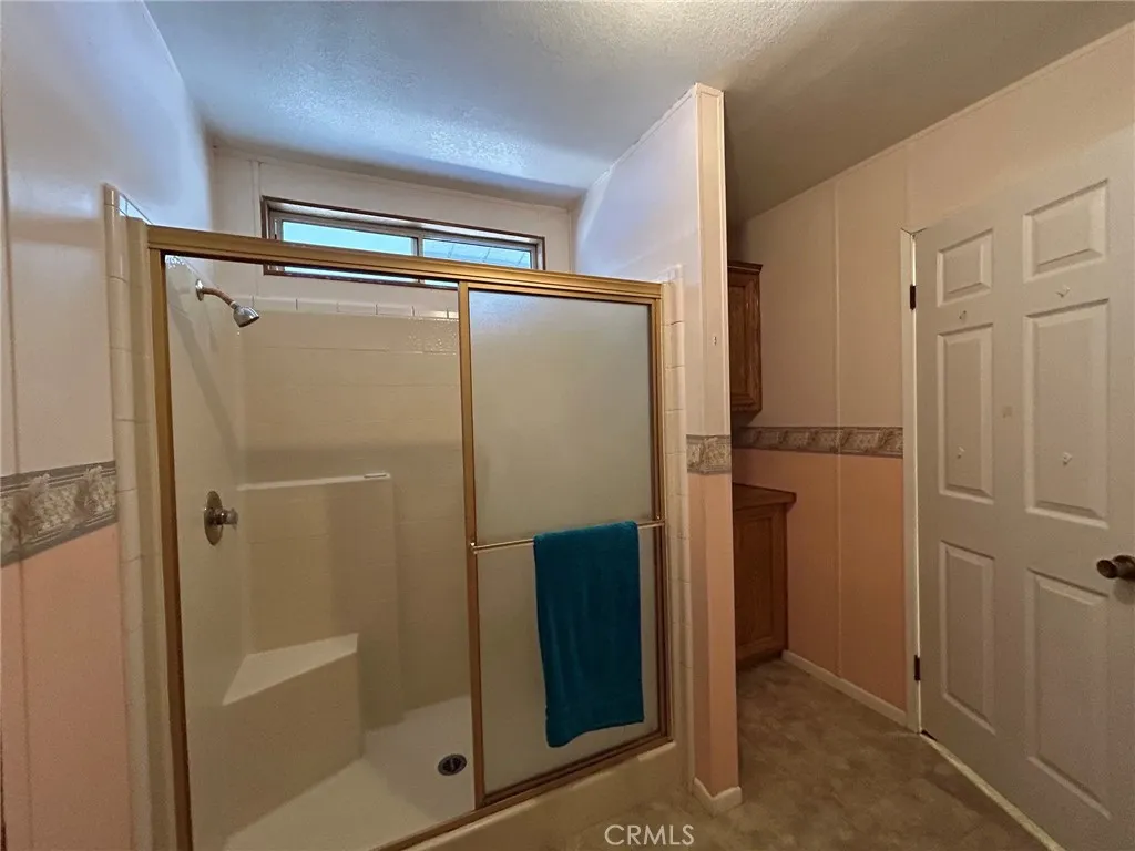 27250 Murrieta Road, Unit 347 Menifee, CA 92586 - Photo 24 of 43 Primary Bathroom Walk-in Shower with Seat