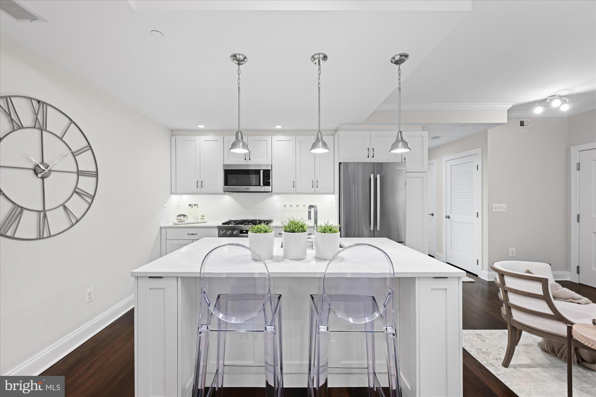 4915 Hampden Lane, Unit 109 Bethesda, MD 20814 - Photo 12 of 74 White Quartz Dining Island