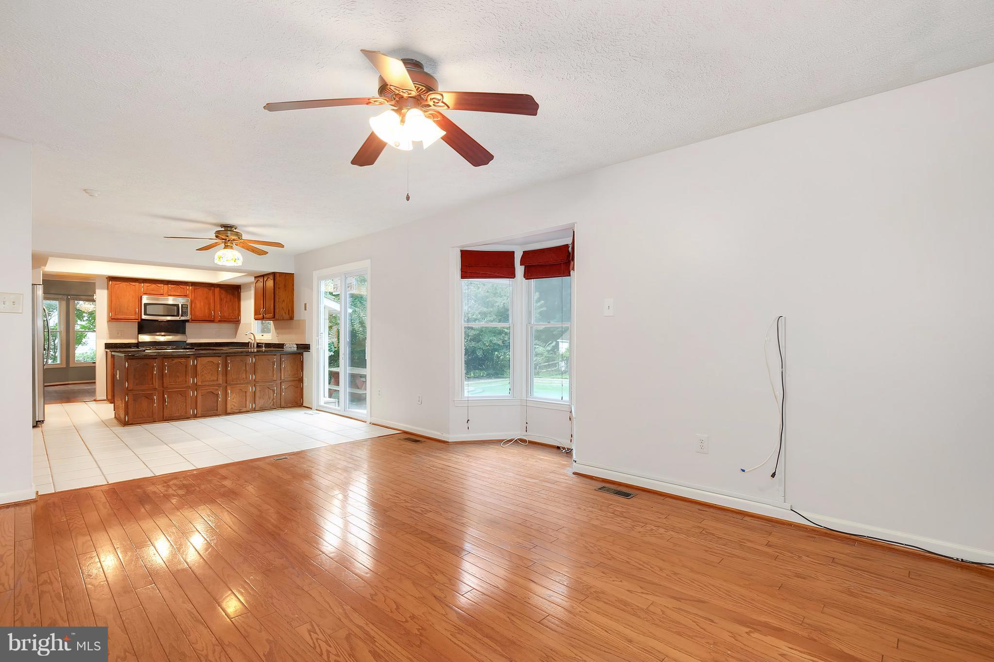 14908 Windmill Terrace Silver Spring, MD 20905 - Photo 11 of 30 a view of livingroom with hardwood floor and a ceiling fan