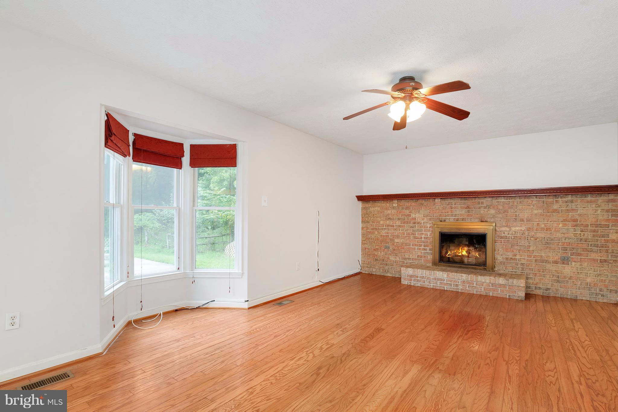14908 Windmill Terrace Silver Spring, MD 20905 - Photo 12 of 30 a view of empty room with a fireplace and window