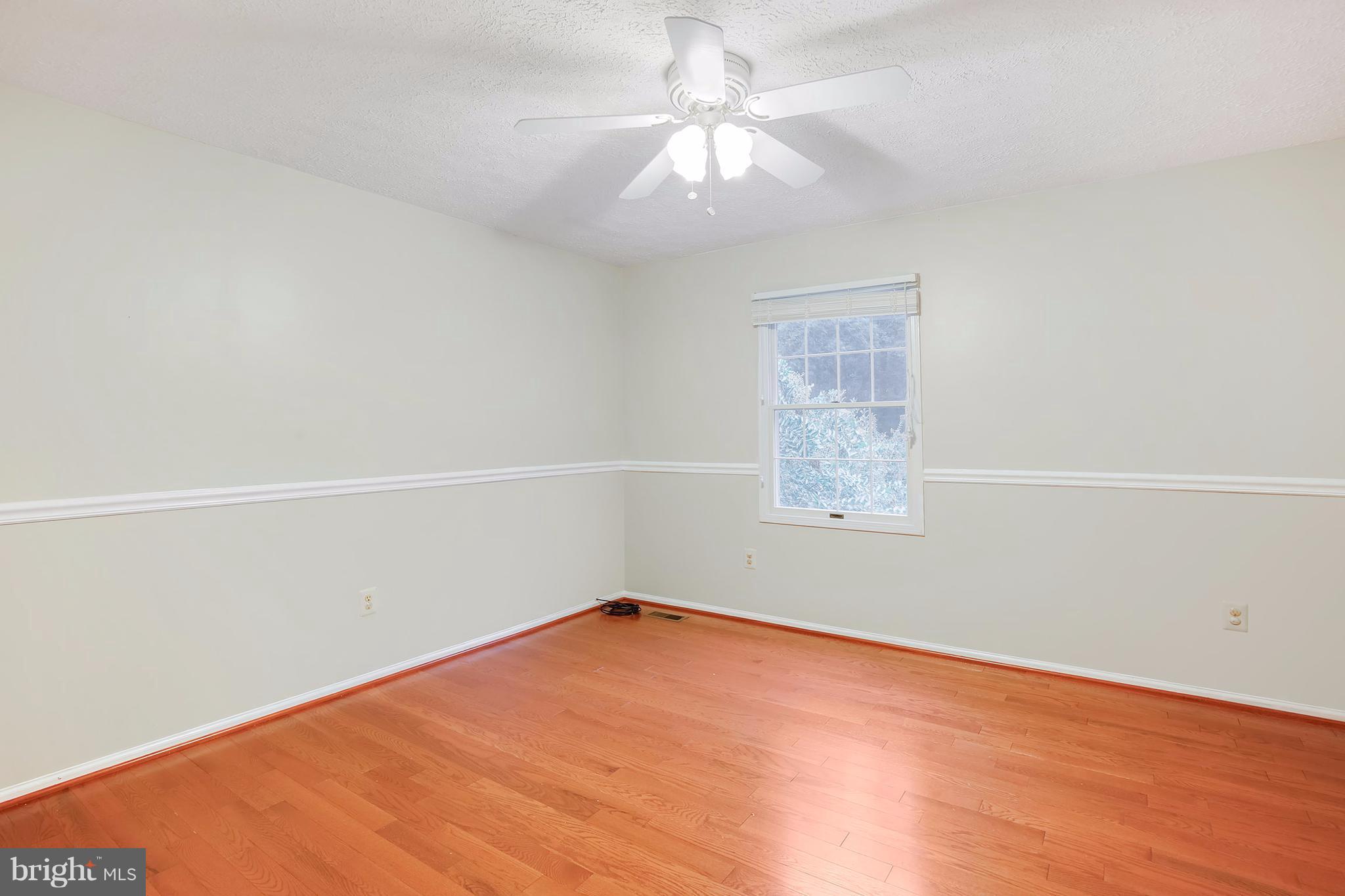 14908 Windmill Terrace Silver Spring, MD 20905 - Photo 17 of 30 an empty room with a chandelier fan