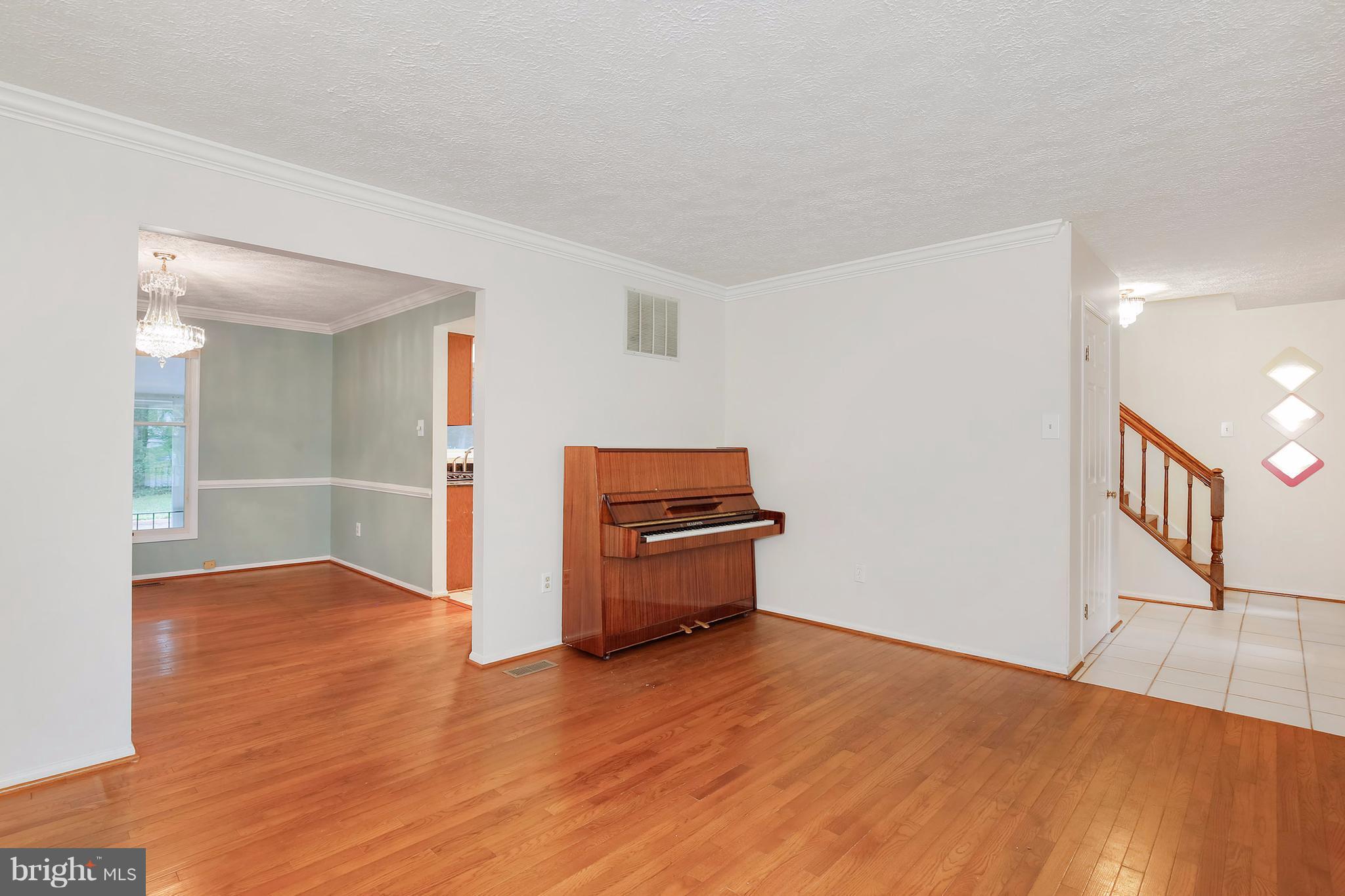 14908 Windmill Terrace Silver Spring, MD 20905 - Photo 3 of 30 a view of a livingroom with wooden floor
