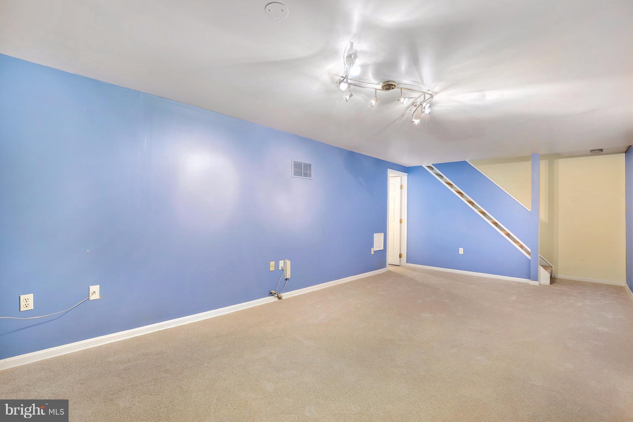 14908 Windmill Terrace Silver Spring, MD 20905 - Photo 21 of 30 a view of an empty room with a chandelier fan