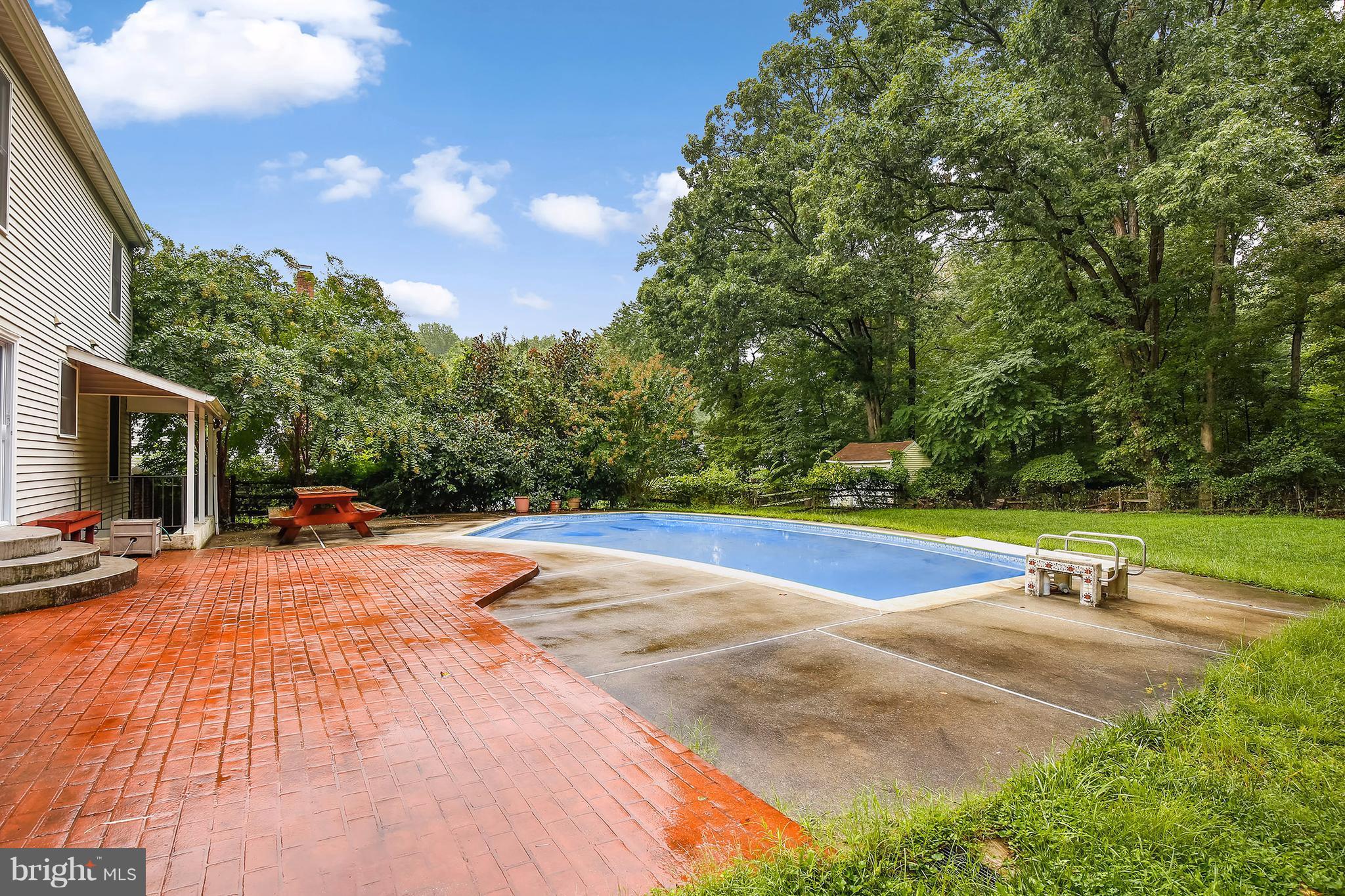 14908 Windmill Terrace Silver Spring, MD 20905 - Photo 25 of 30 a view of a swimming pool with a yard