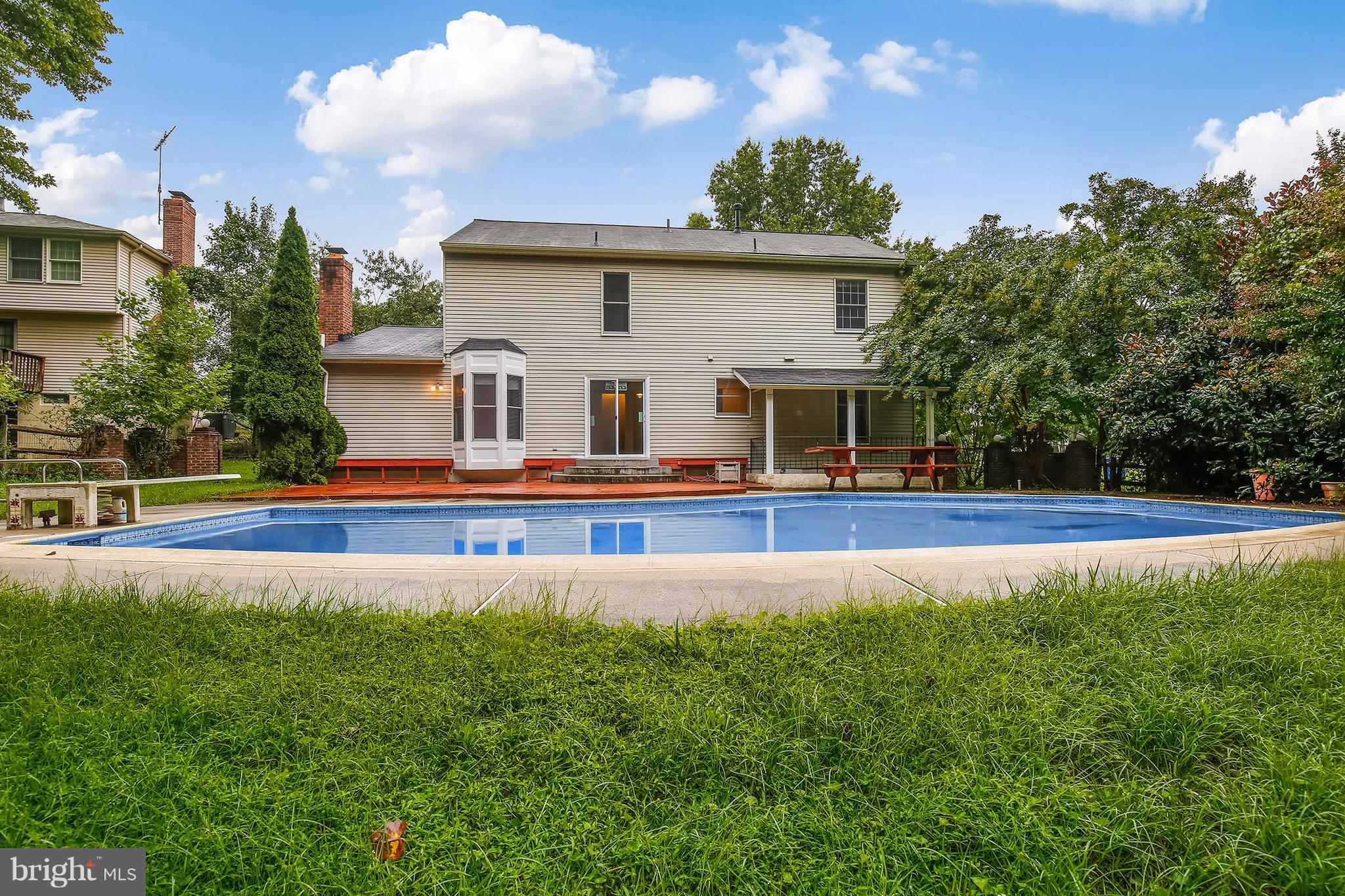 14908 Windmill Terrace Silver Spring, MD 20905 - Photo 26 of 30 a front view of house with yard and outdoor seating