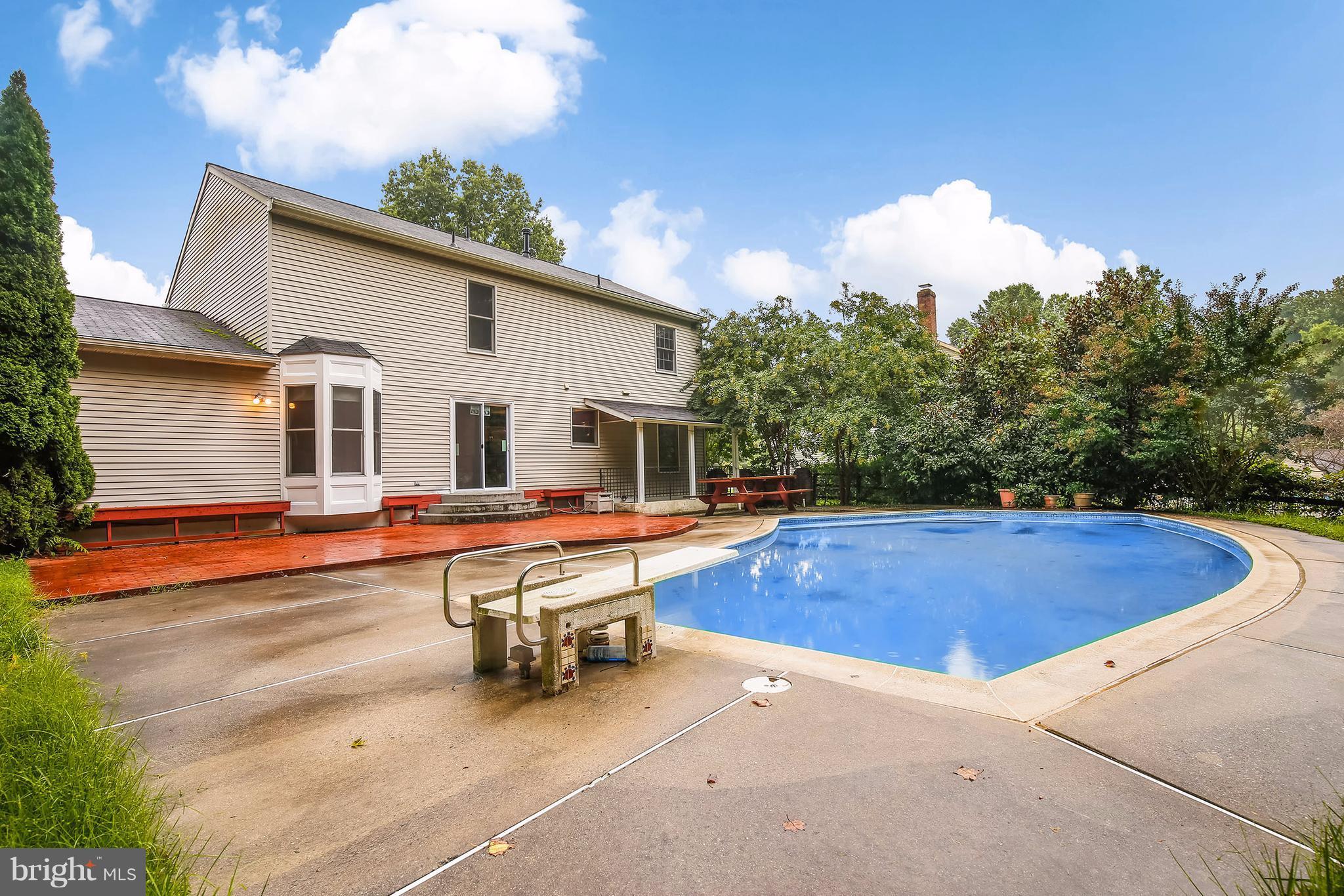 14908 Windmill Terrace Silver Spring, MD 20905 - Photo 27 of 30 a view of a house with swimming pool and sitting area
