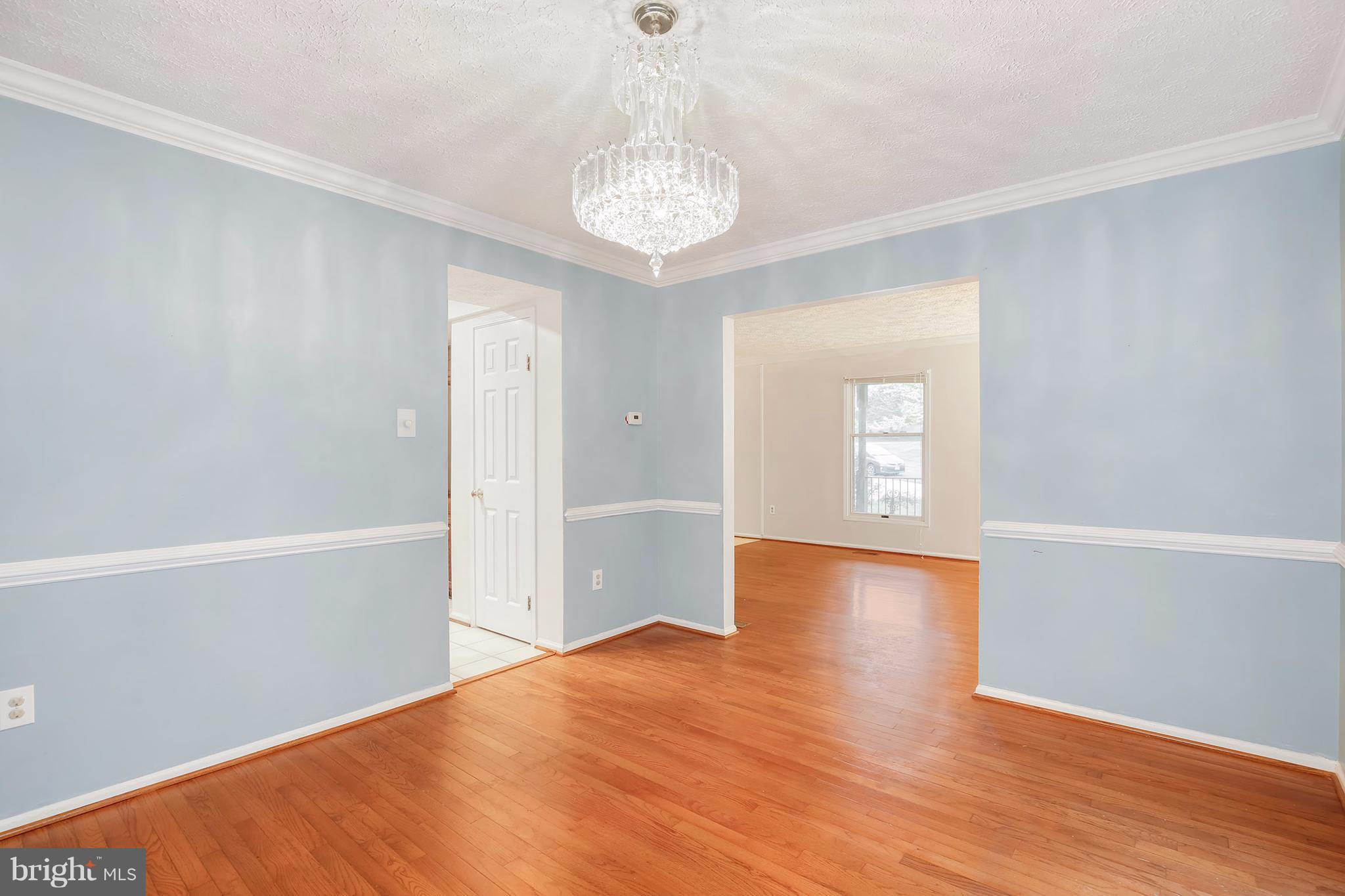 14908 Windmill Terrace Silver Spring, MD 20905 - Photo 5 of 30 wooden floor in an empty room with a window