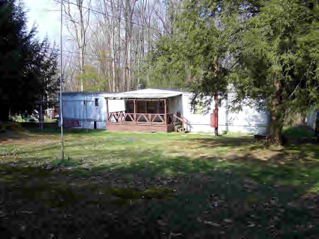 1 Maple Lane Lucinda, PA 16235 - Photo 1 of 1 a view of a house with a yard porch and sitting area