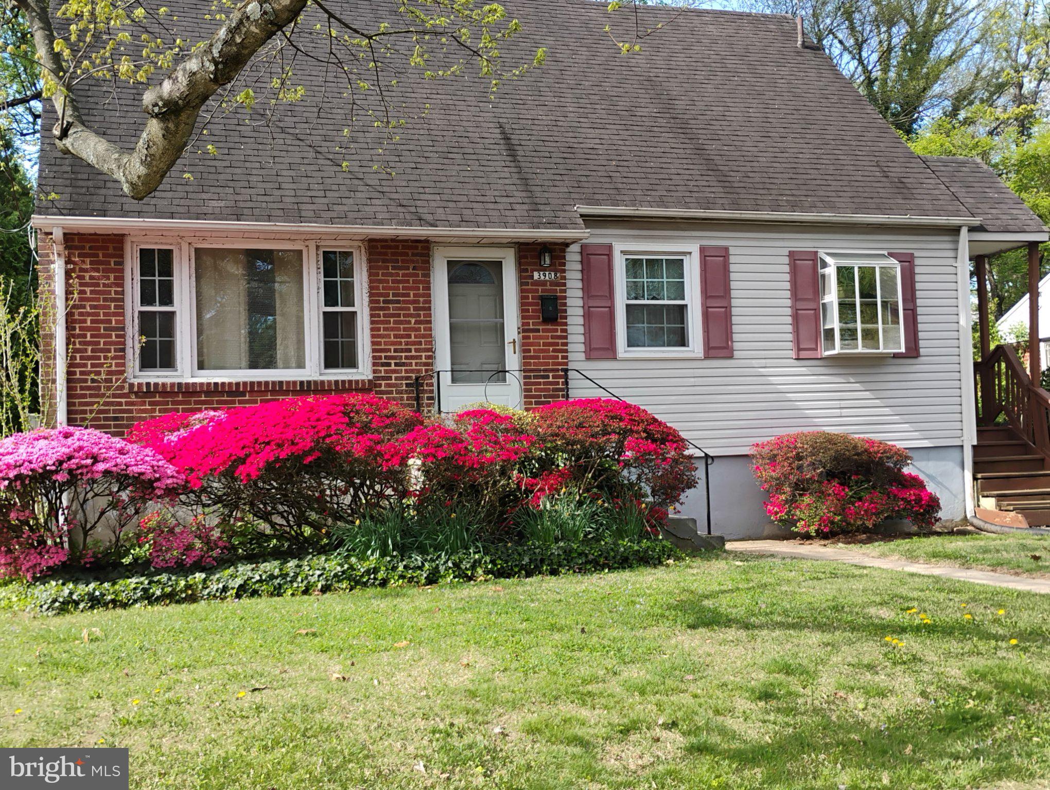 Charming home with vibrant blooms.
