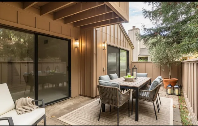 a dining room with furniture and window
