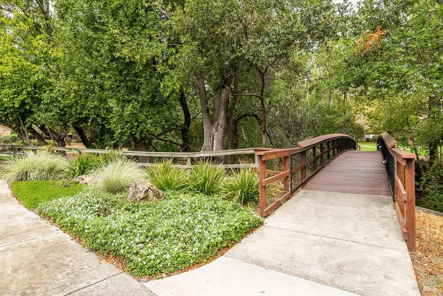 a view of a garden from a balcony