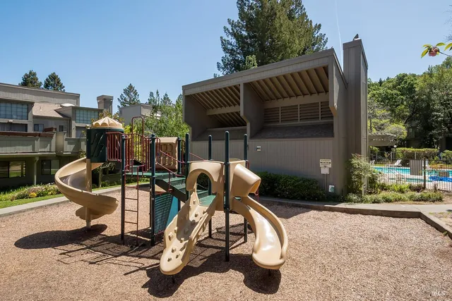 a view of backyard with dishwasher and outdoor seating
