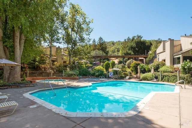a view of a swimming pool with a patio