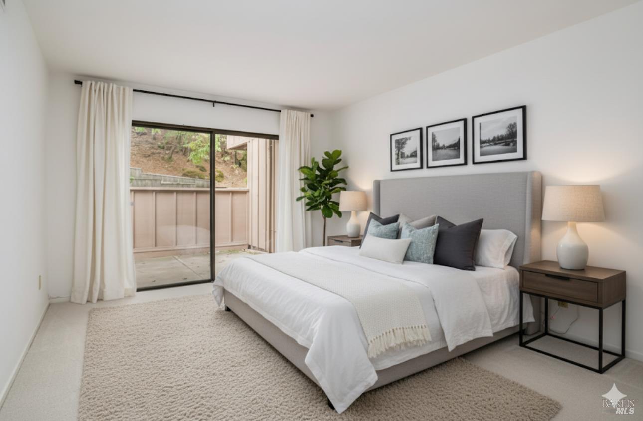 16 California Condor Way Novato, CA 94949 - Photo 7 of 21 a bedroom with a large bed and a window