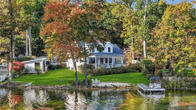 a house with swimming pool in front of it