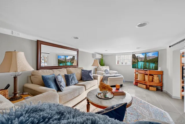 a dining room with furniture a chandelier and wooden floor
