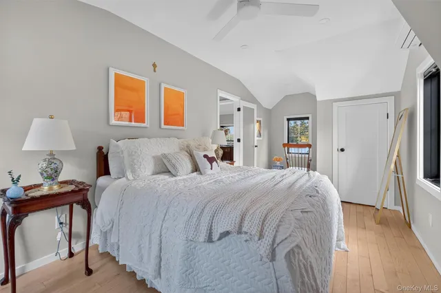 a bedroom with bed and window