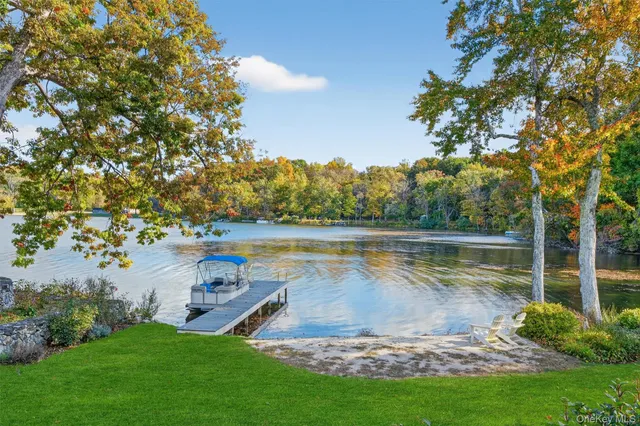a view of a lake with a yard