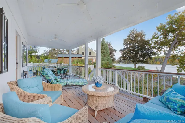 a view of a balcony with wooden floor and outdoor space