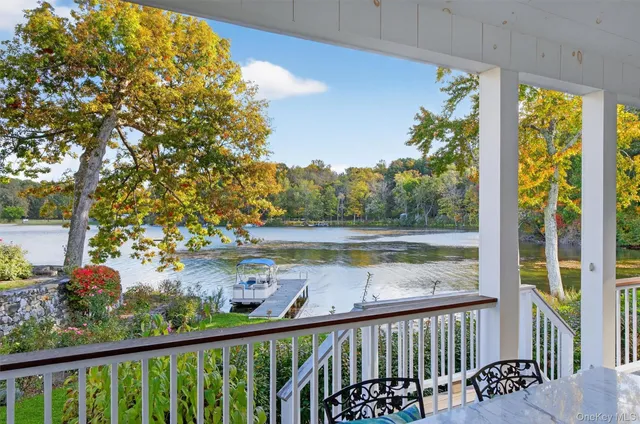 a view of a patio with iron fence