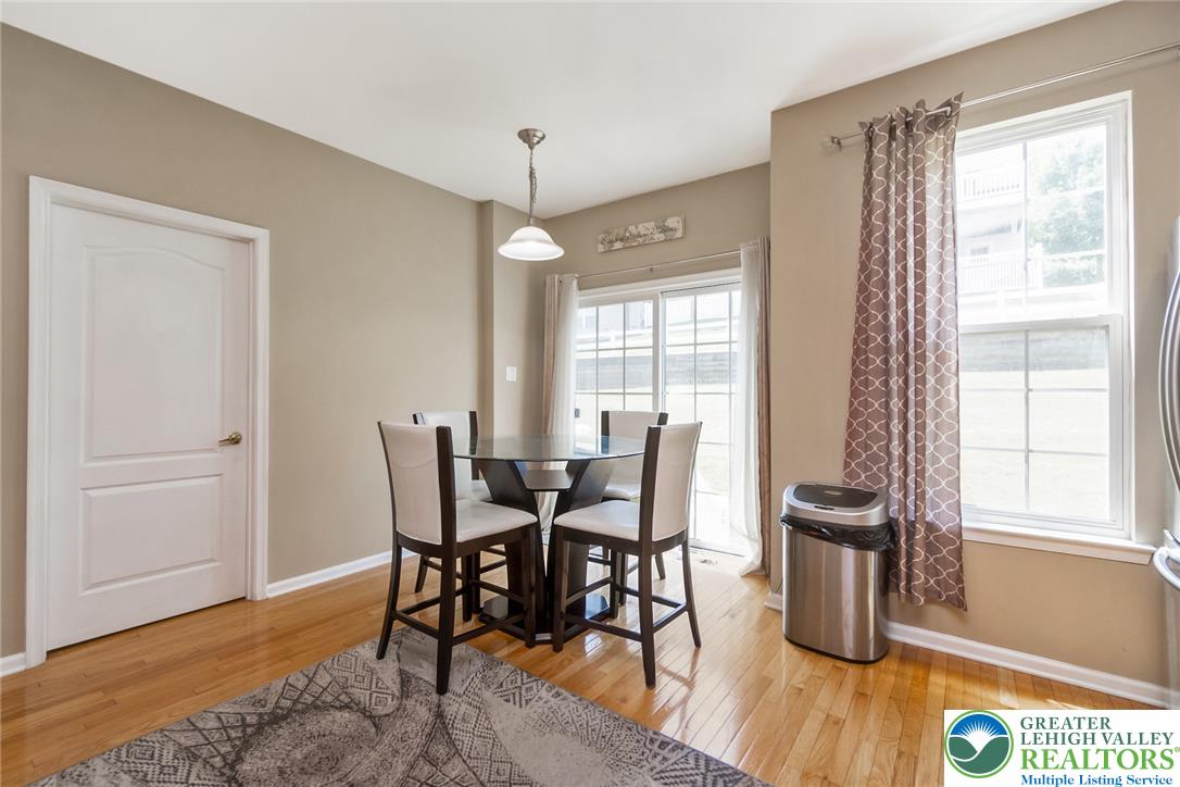 3566 Penfield Way Nazareth, PA 18064 - Photo 14 of 47 Bright hardwood floors and abundant natural light create an inviting atmosphere in this kitchen eating area.