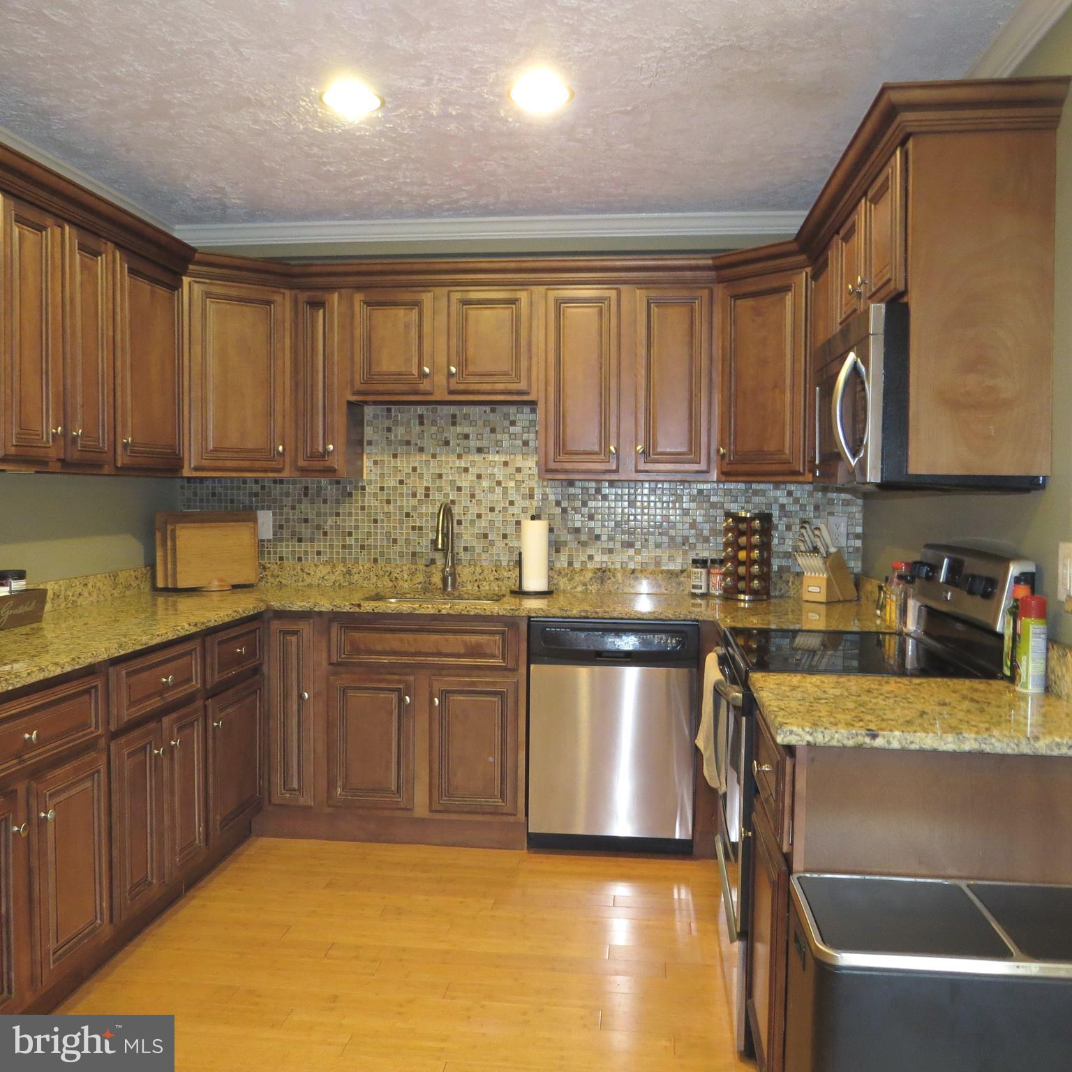 22 Hobb Court Perry Hall, MD 21128 - Photo 14 of 42 a kitchen with stainless steel appliances granite countertop a sink and cabinets