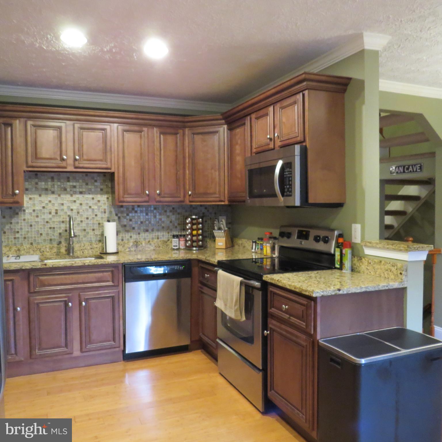 22 Hobb Court Perry Hall, MD 21128 - Photo 15 of 42 a kitchen with stainless steel appliances granite countertop a sink stove and cabinets