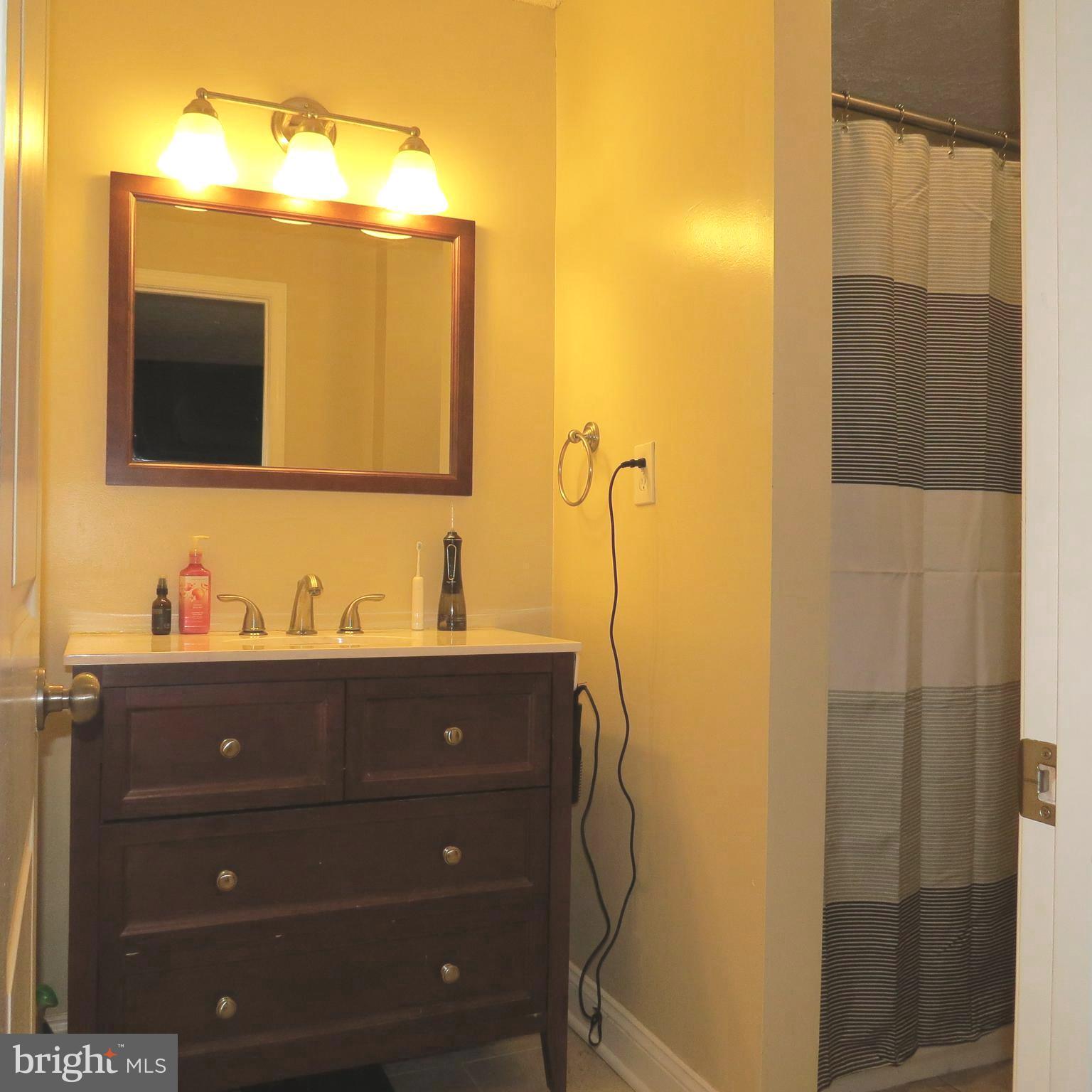 22 Hobb Court Perry Hall, MD 21128 - Photo 20 of 42 a bathroom with a sink and a mirror