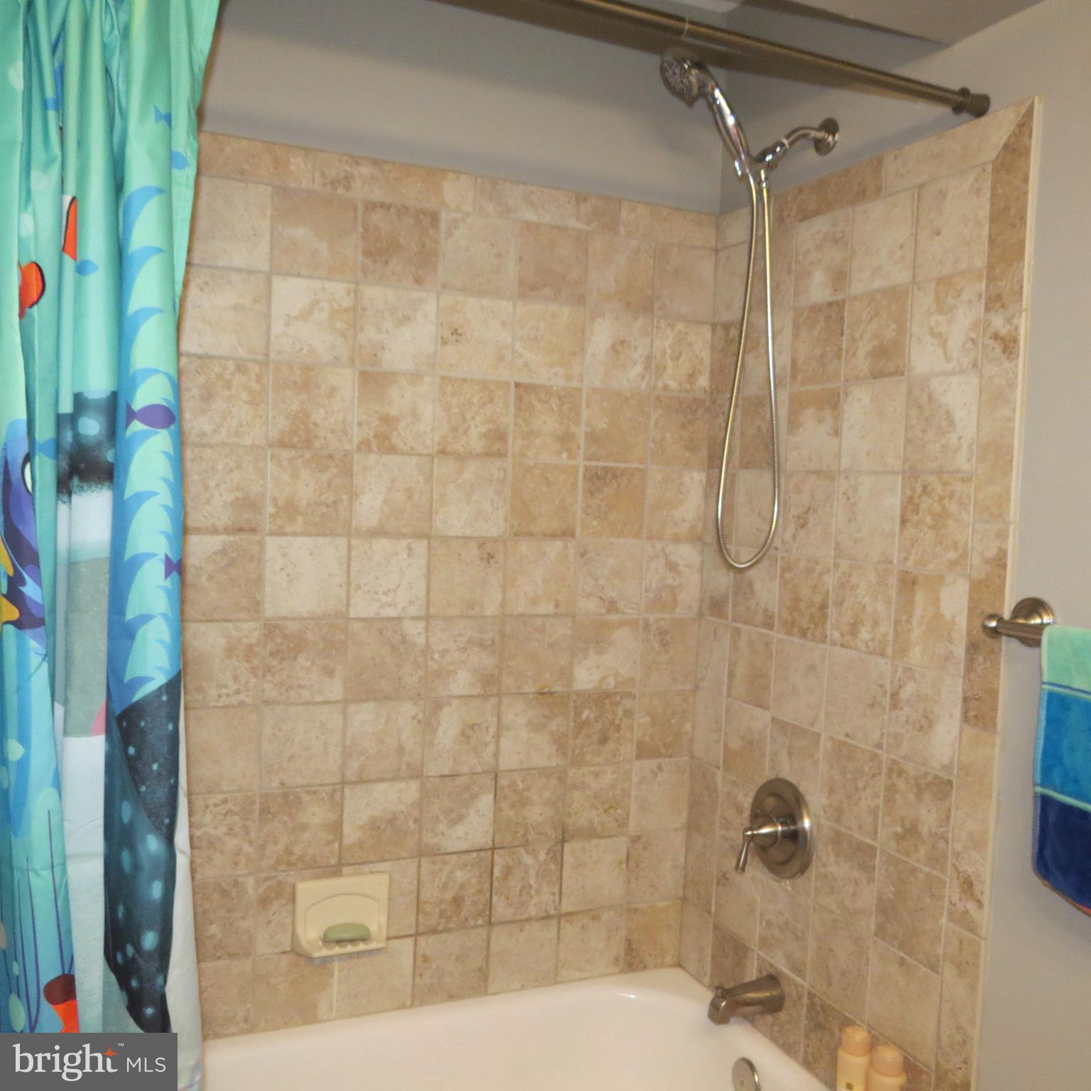 22 Hobb Court Perry Hall, MD 21128 - Photo 31 of 42 a bathroom with a shower and a mirror