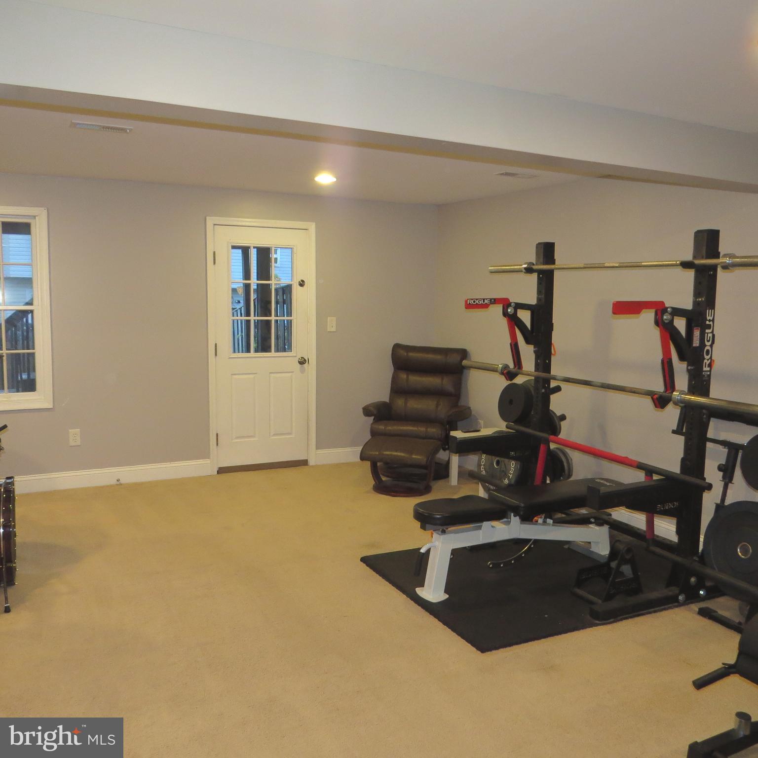 22 Hobb Court Perry Hall, MD 21128 - Photo 32 of 42 a room with gym equipment and wooden floor