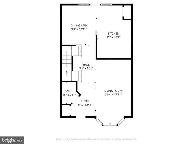 a picture of a bench in front of a wall