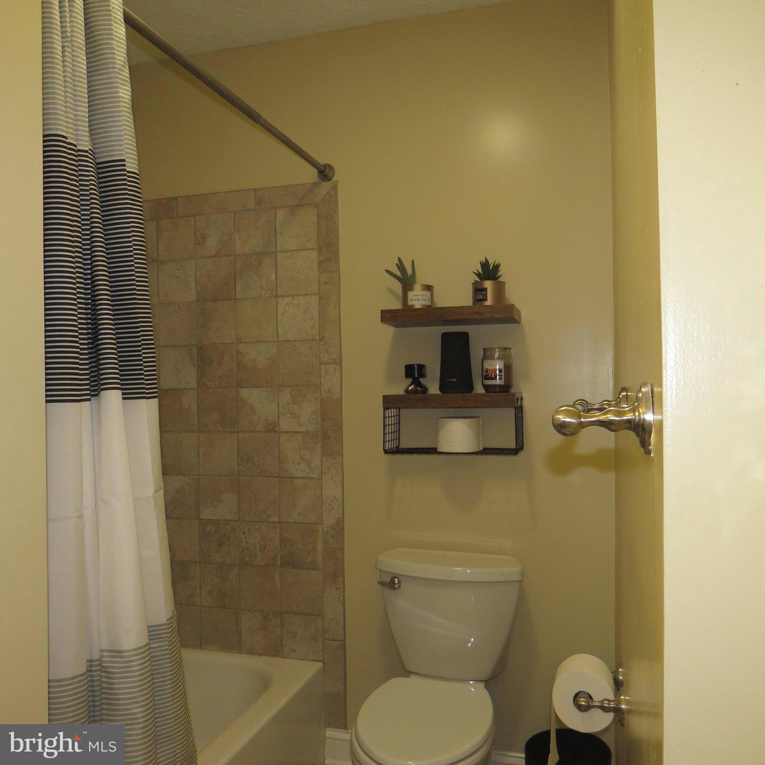 22 Hobb Court Perry Hall, MD 21128 - Photo 6 of 42 a bathroom with a toilet and a shower