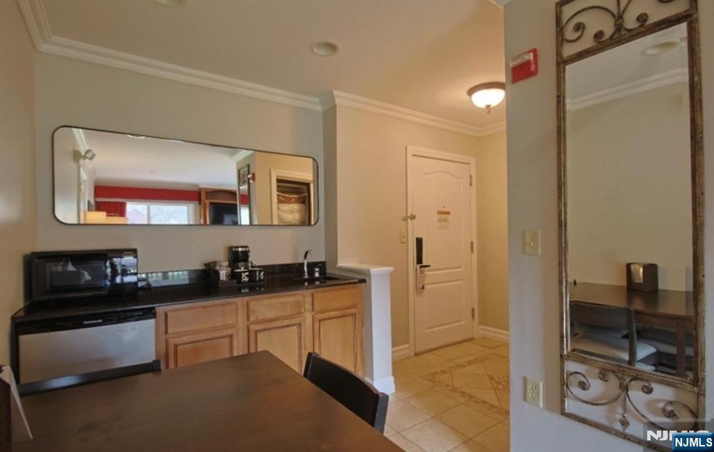 2 Chamonix Drive, Unit 427 Vernon, NJ 07462 - Photo 8 of 11 a kitchen with a sink and cabinets