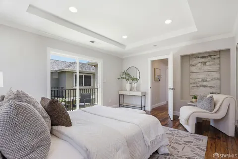 a bedroom with a bed and a chair