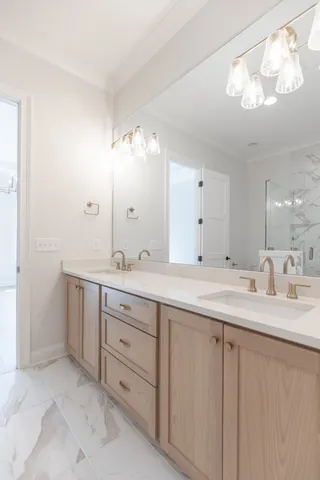 a spacious bathroom with double sink and a mirror