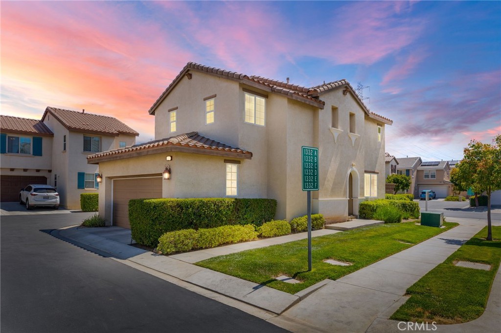 1332 Rover Lane, Unit F Beaumont, CA 92223 - Photo 1 of 1 a front view of a house with garage