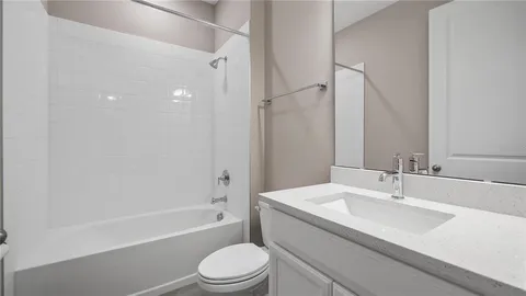 a bathroom with a sink a toilet and a bathtub